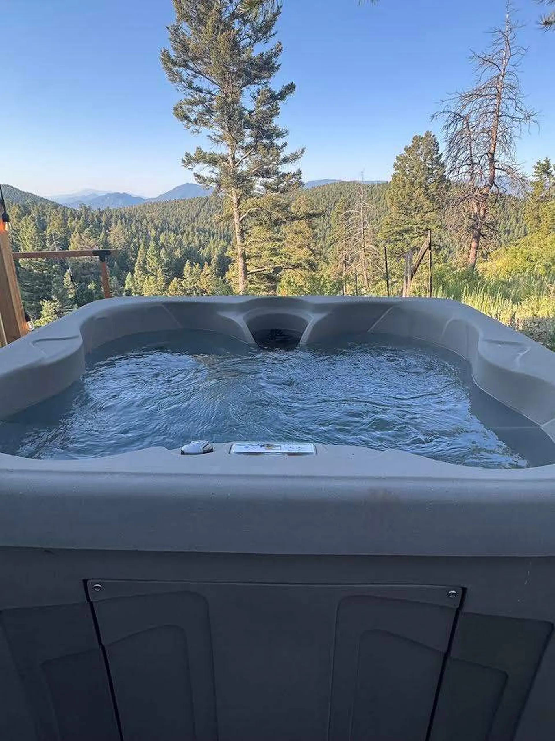Hot tub with a scenic mountain view.