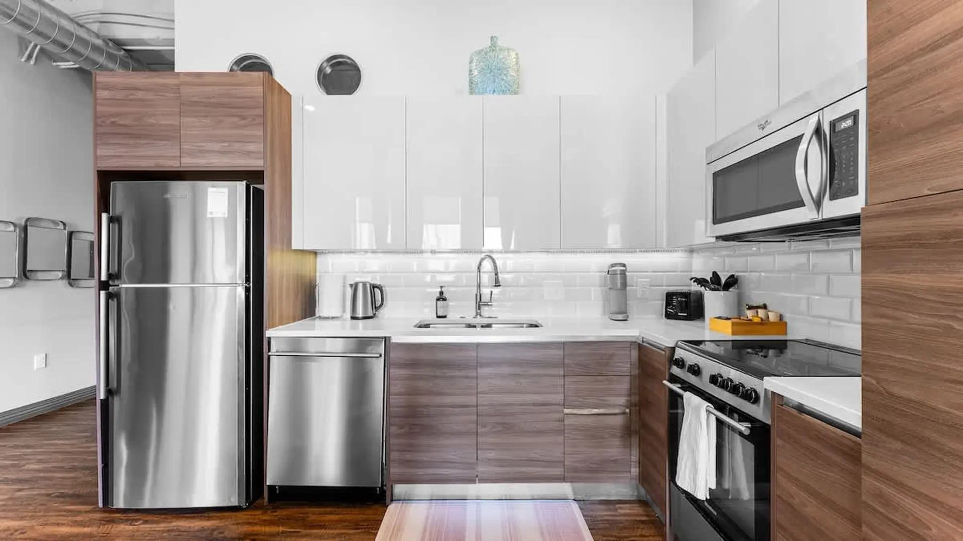 Modern kitchen with stainless steel appliances and sleek cabinetry.