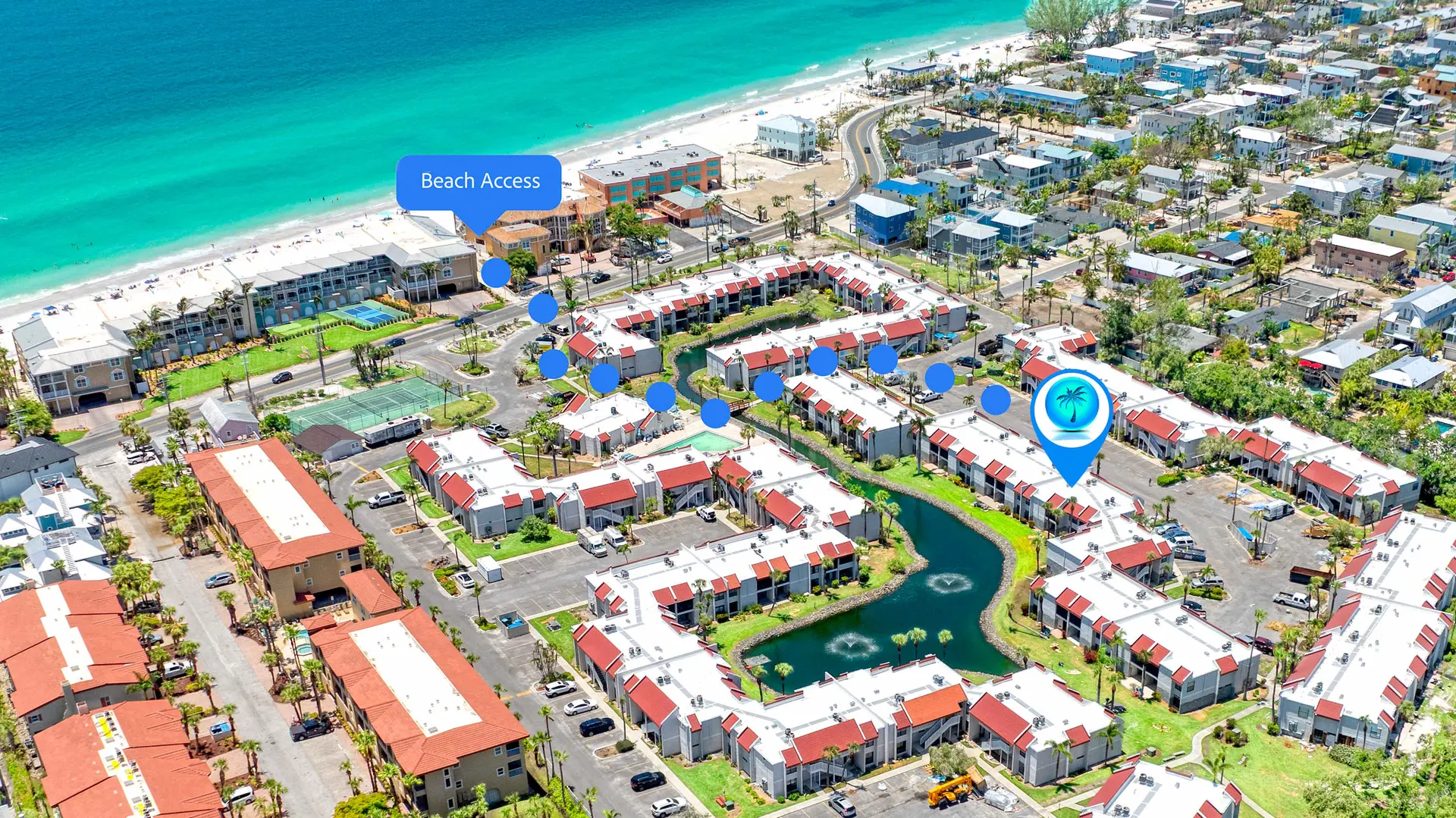 Aerial view of a coastal resort with buildings, pools, tennis courts, and beach access.