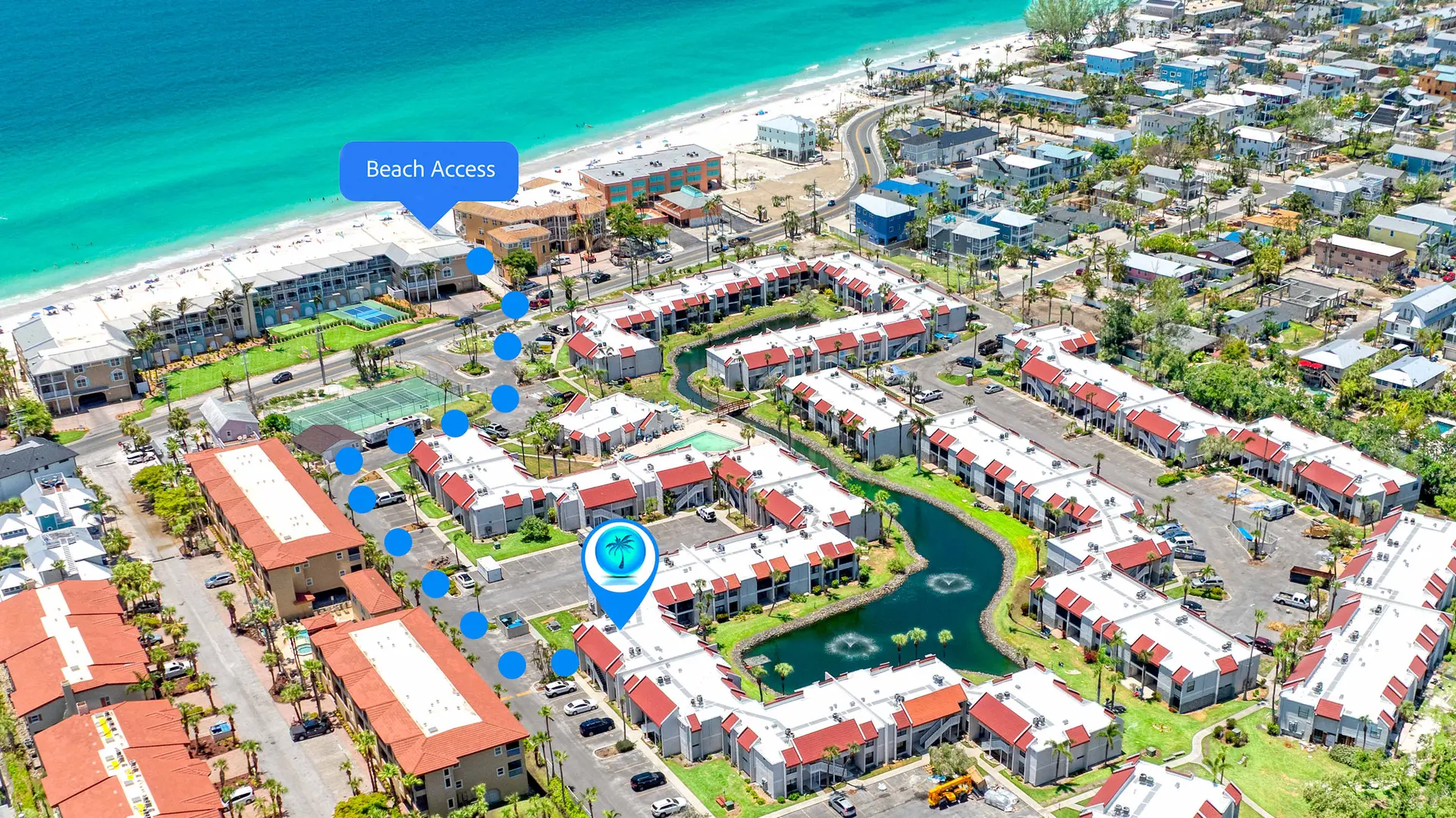 Aerial view of a beach resort complex with apartments, pools, and beach access.