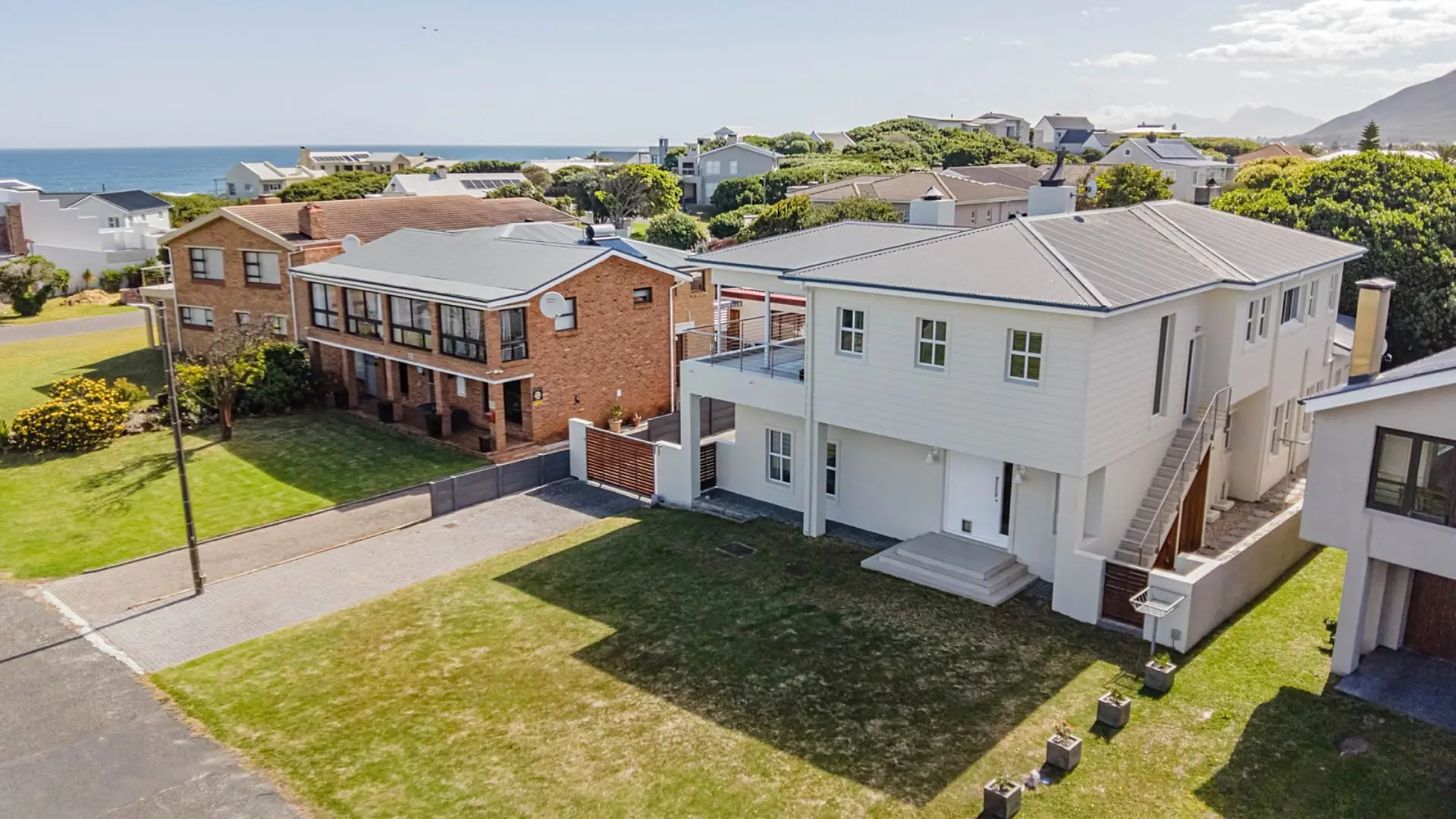 Coastal houses with ocean views and modern architecture.