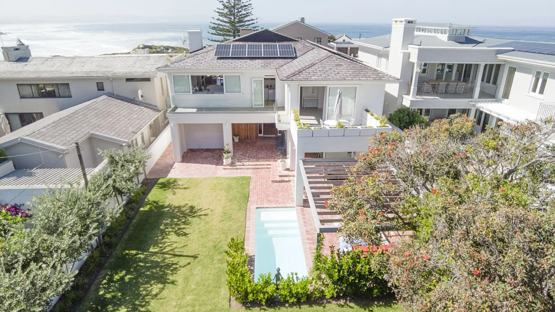 Luxury modern house with a pool and ocean view.
