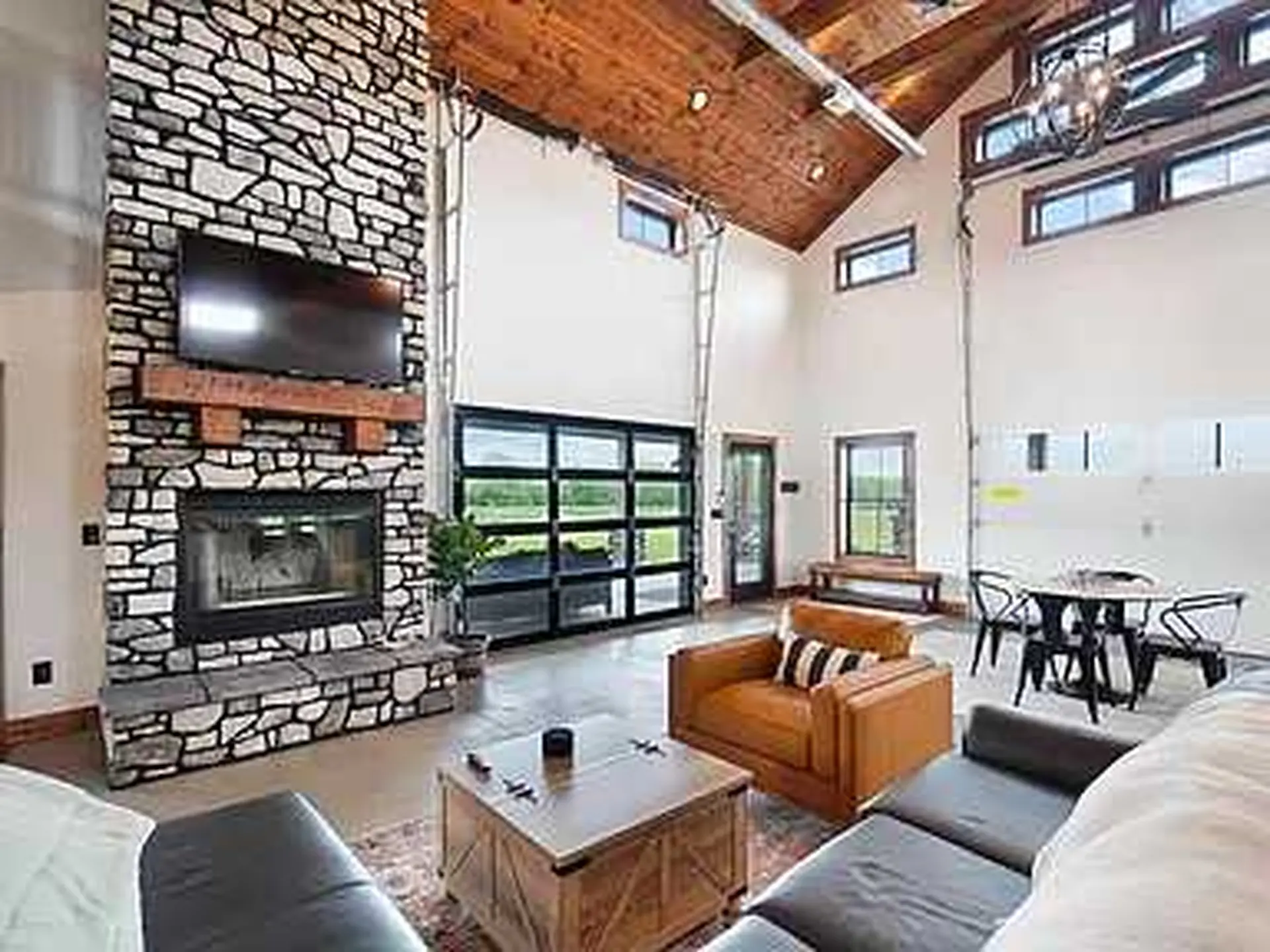 This image shows a living room that combines rustic and modern elements.