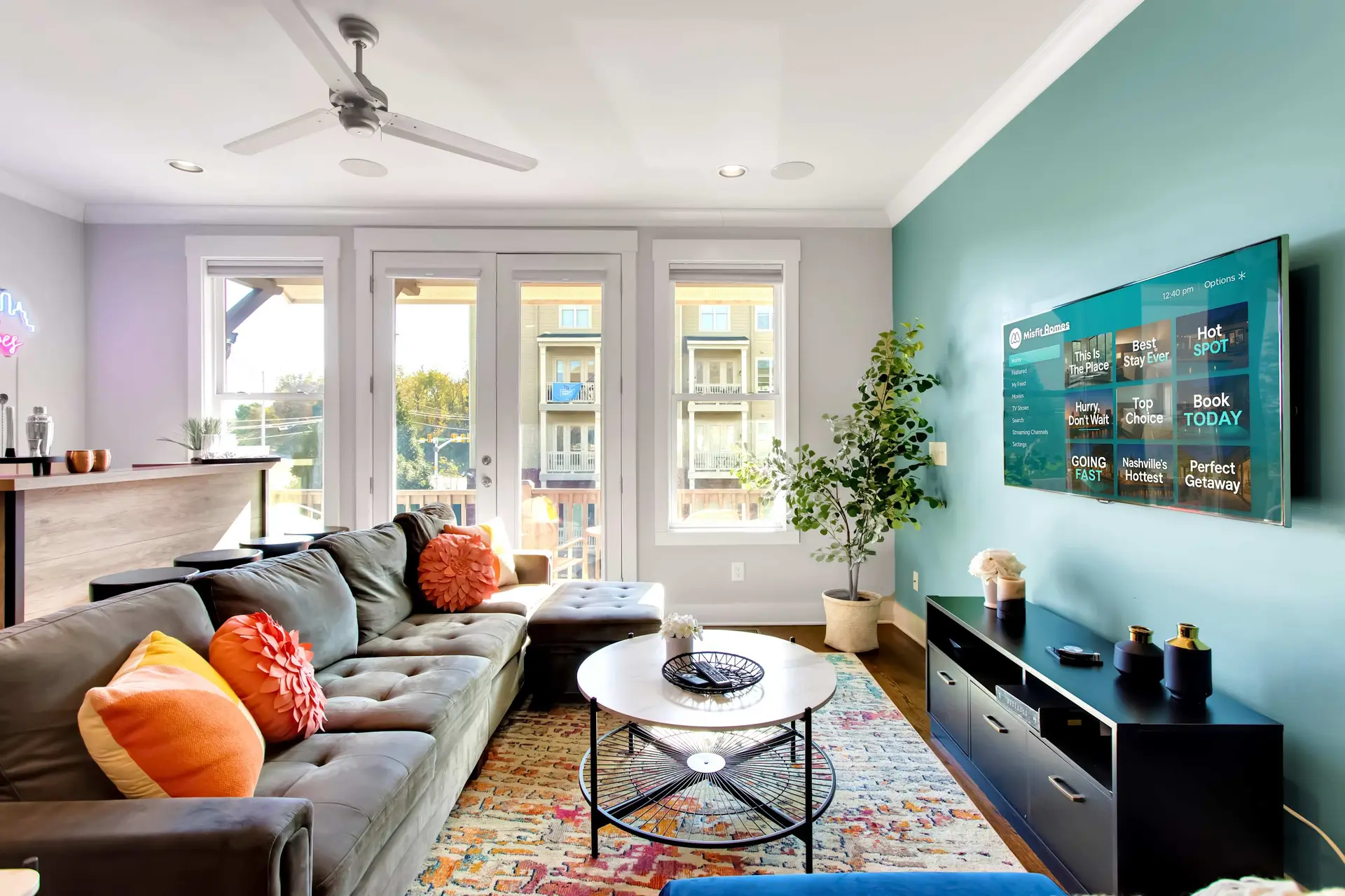 A living room with a sectional sofa, coffee table, and TV.