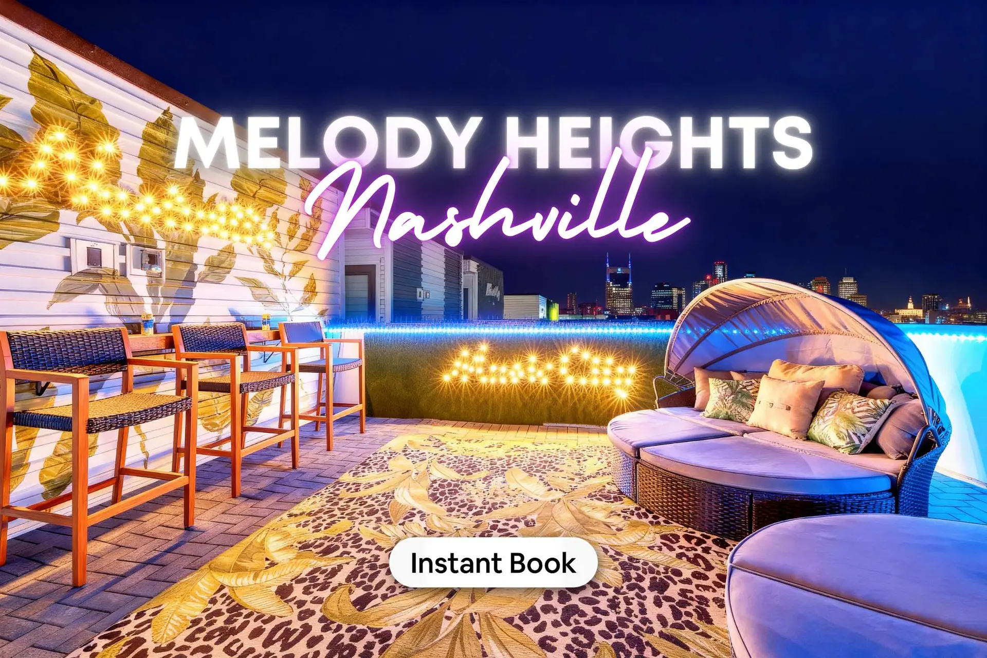 Rooftop patio with Nashville skyline, bar stools, a canopy bed, and string lights.