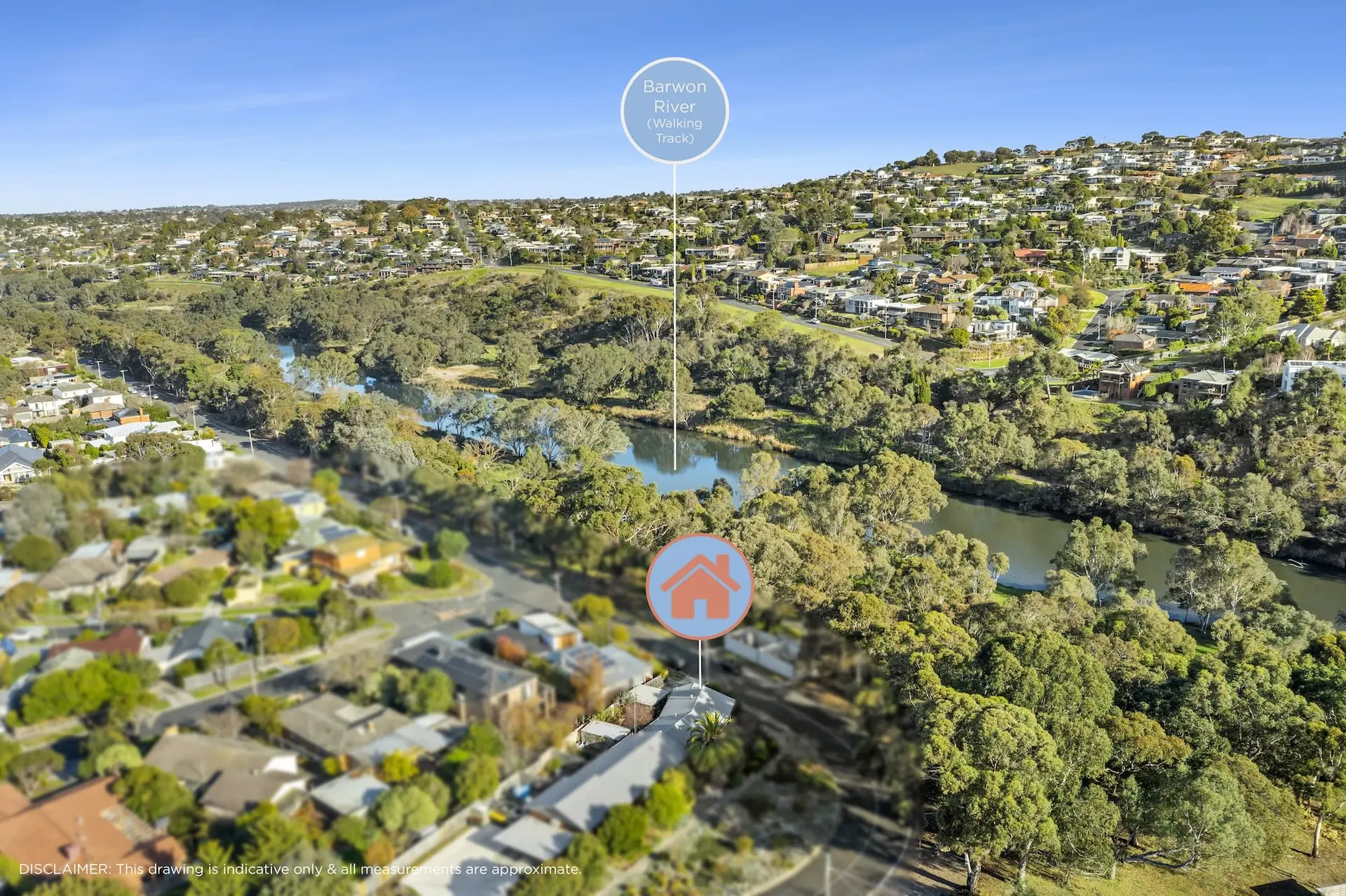 Aerial view of houses near a river with a walking track.