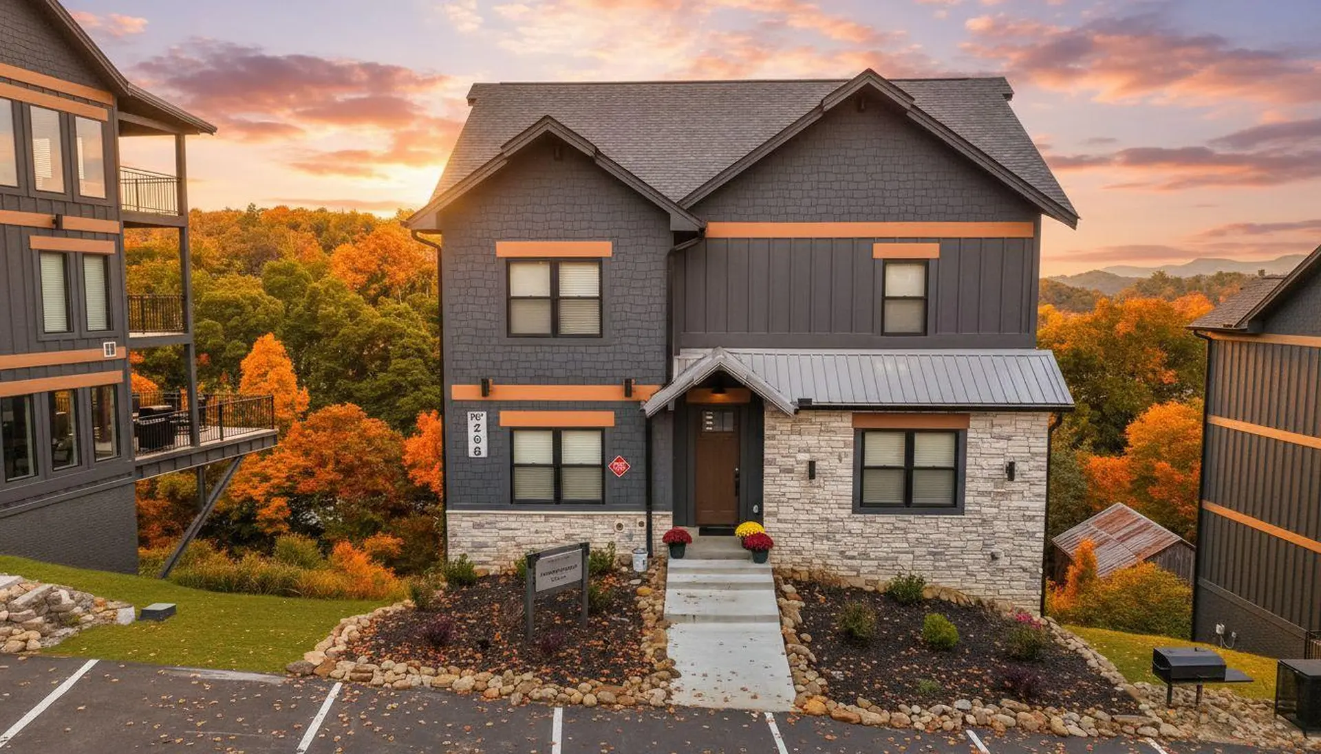 Modern mountain home with autumn foliage during sunset.