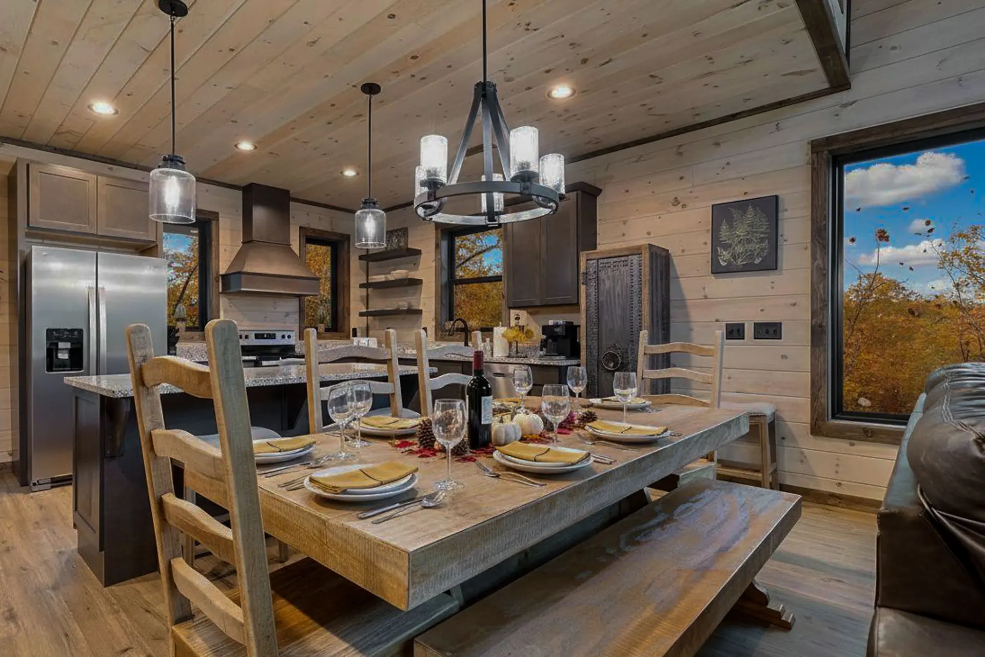 Dining room with a wooden table set for a meal.