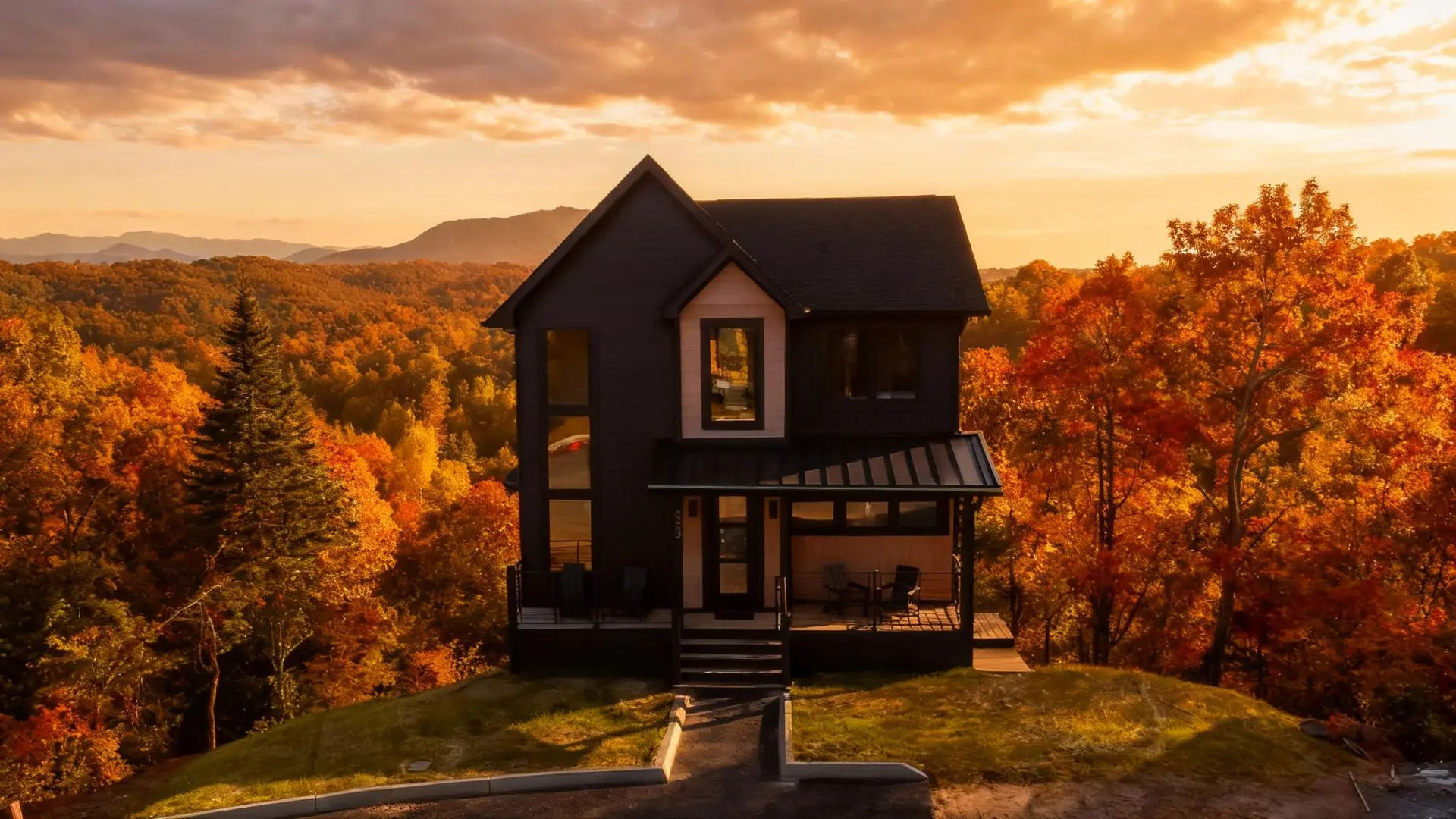 Modern house nestled amidst autumn foliage under a golden sunset.
