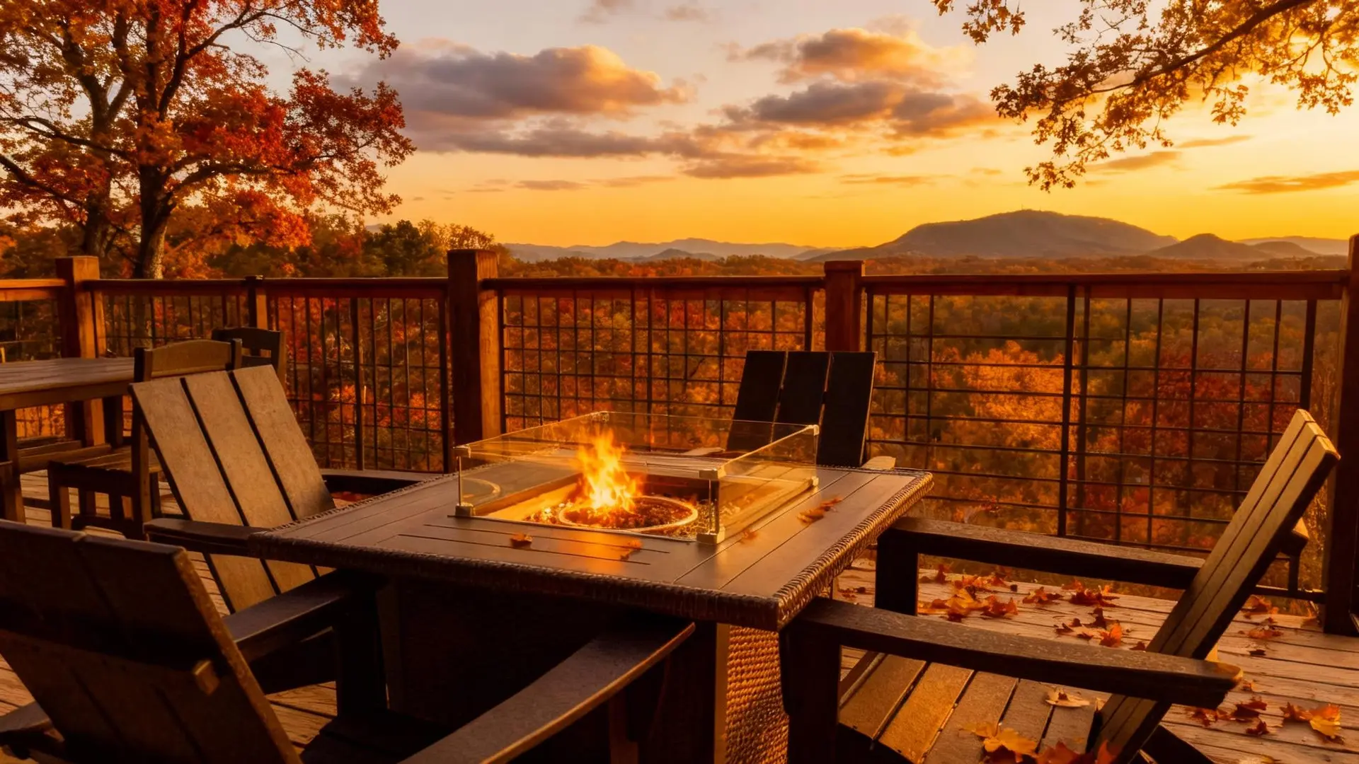 Autumn deck with fire pit and mountain view at sunset.