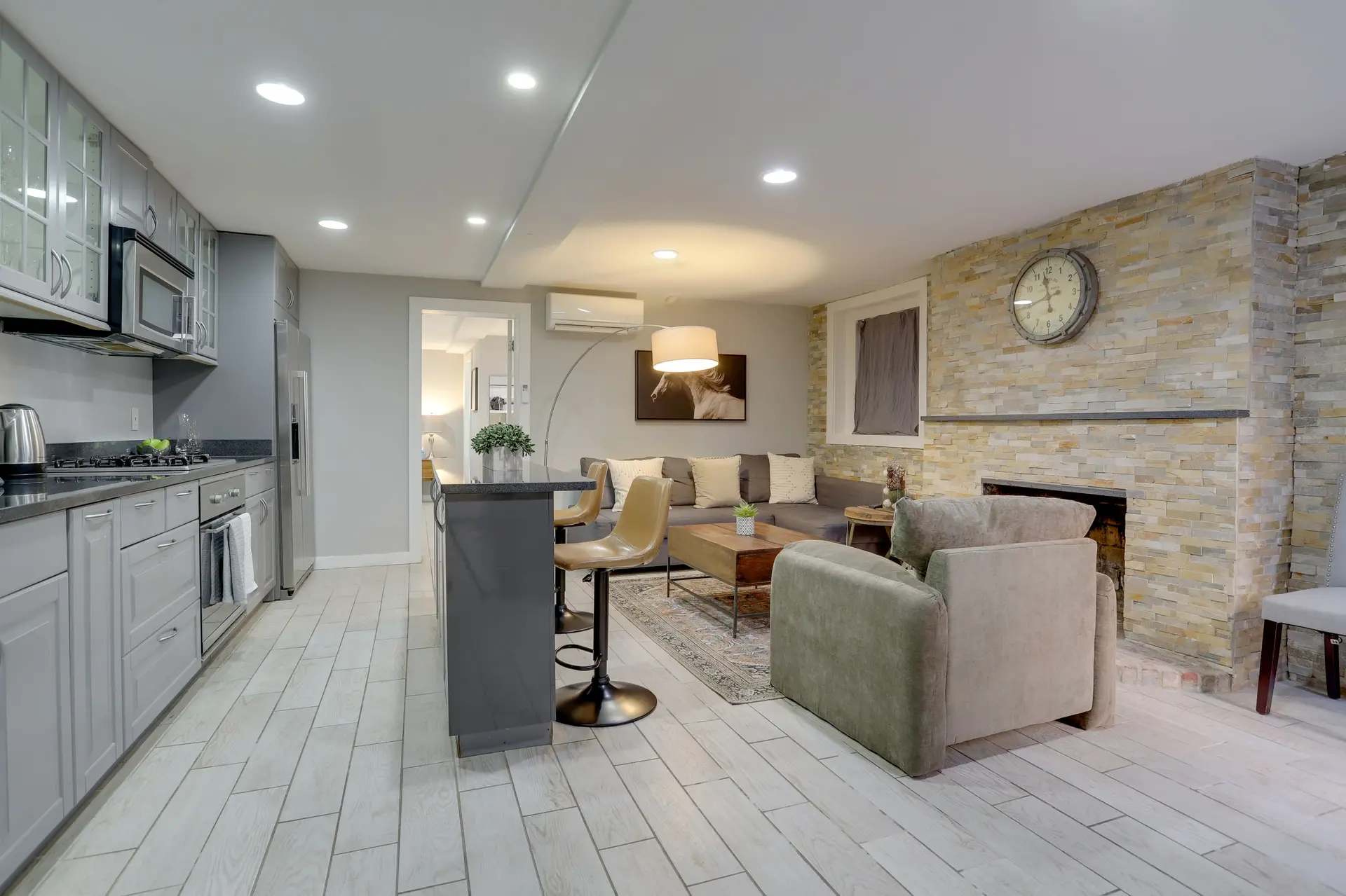 Kitchen and living area with fireplace.
