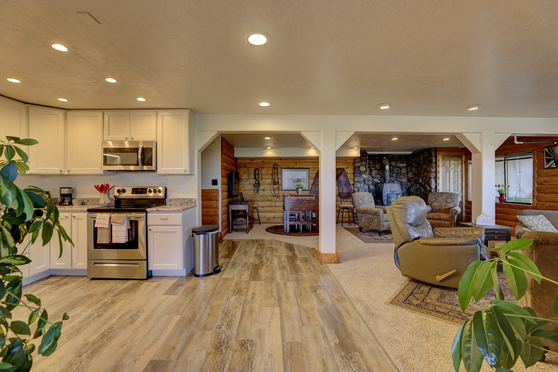 A spacious, open-plan living area with a kitchen, dining area, and living room.