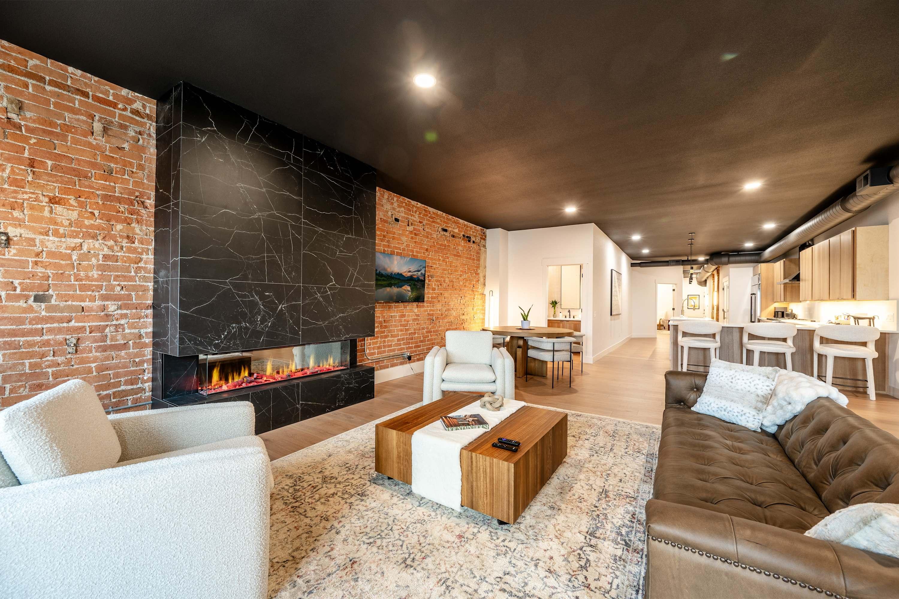 The Main Exchange — Two industrial-chic suites above Main, walkable to the Mint Bar, Frackelton's, King's Saddlery, and Black Tooth. Built for the gatherings where the room matters as much as the menu.