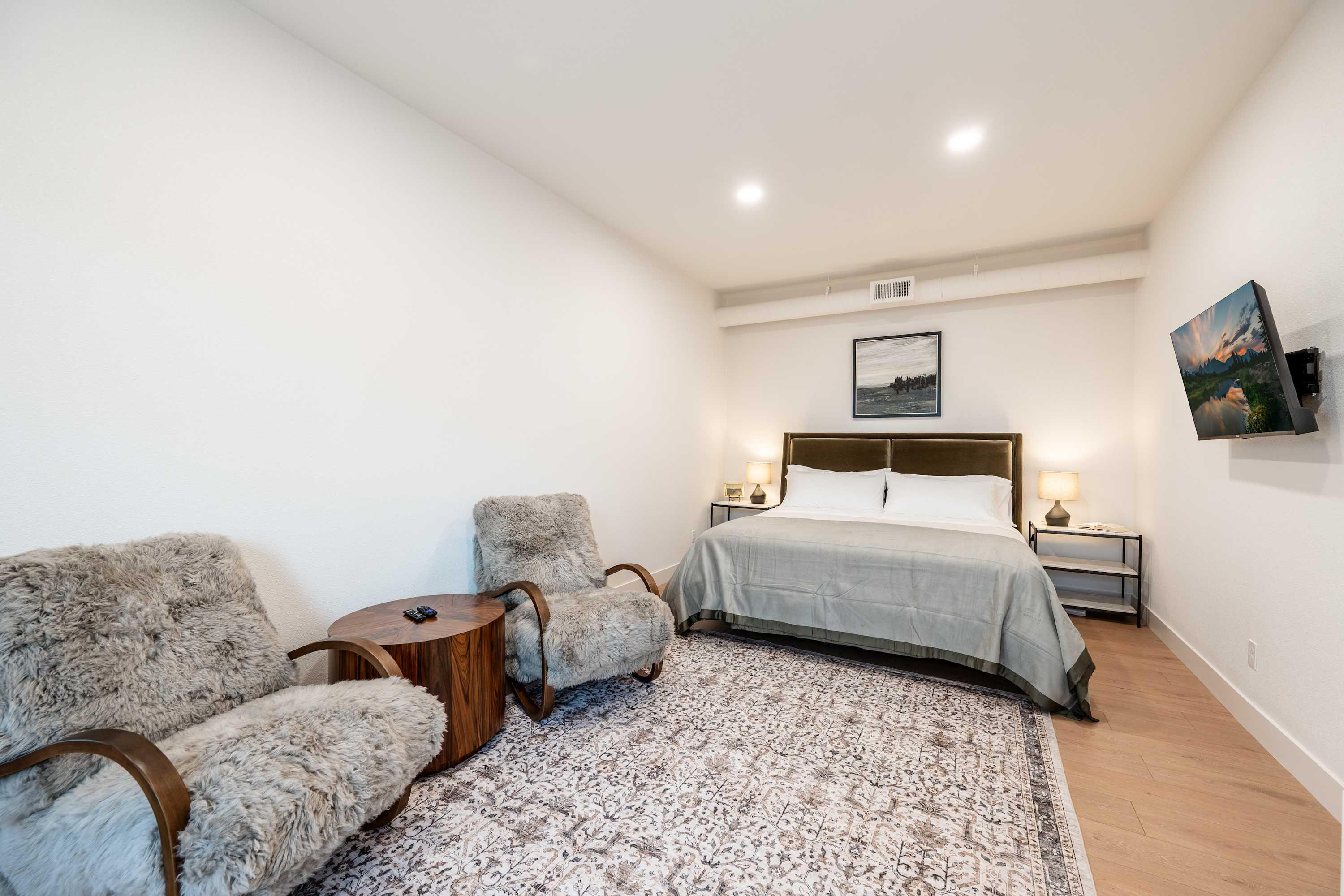 King bedroom with luxury linens at The Onyx