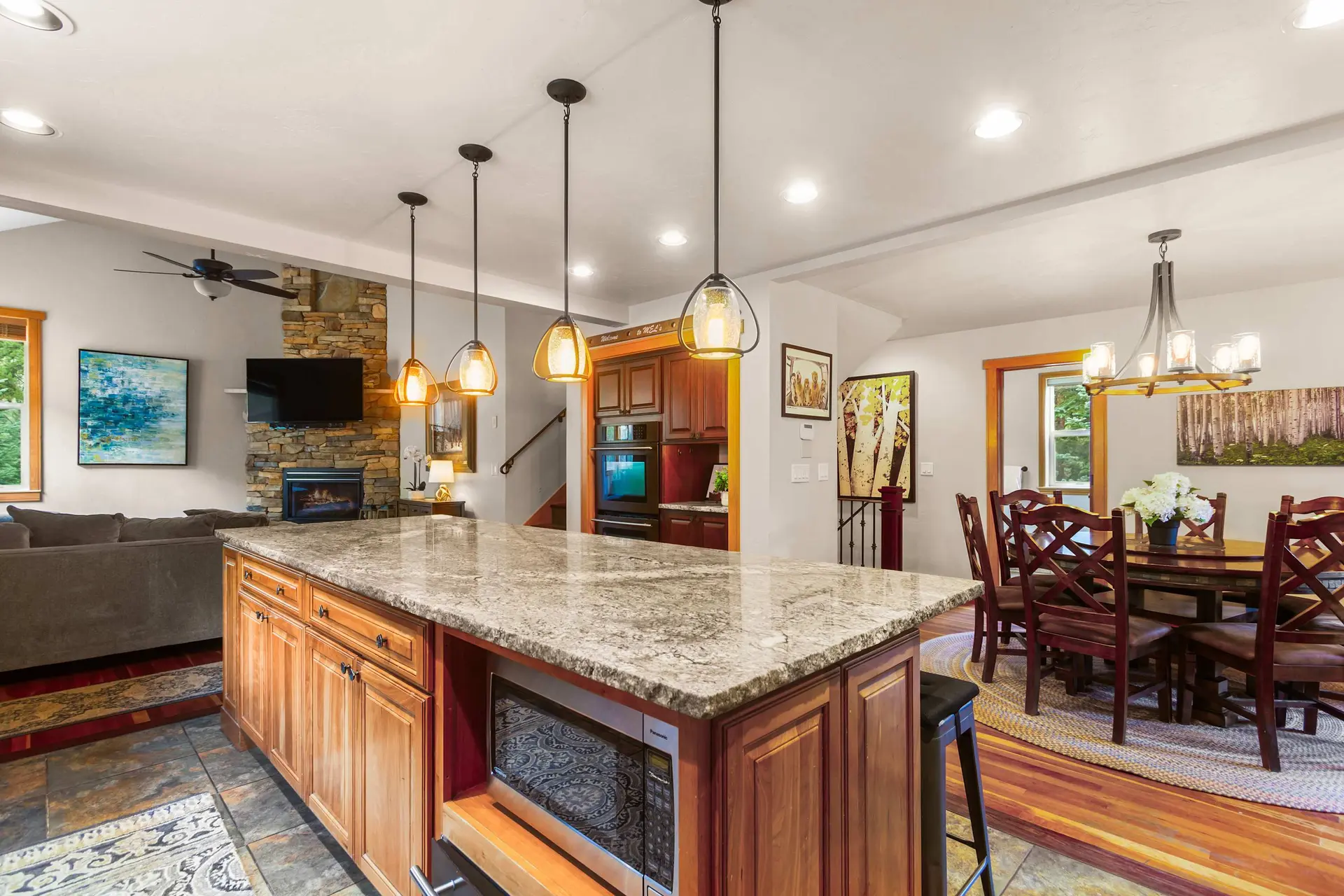 Kitchen with island, living area, and dining room.